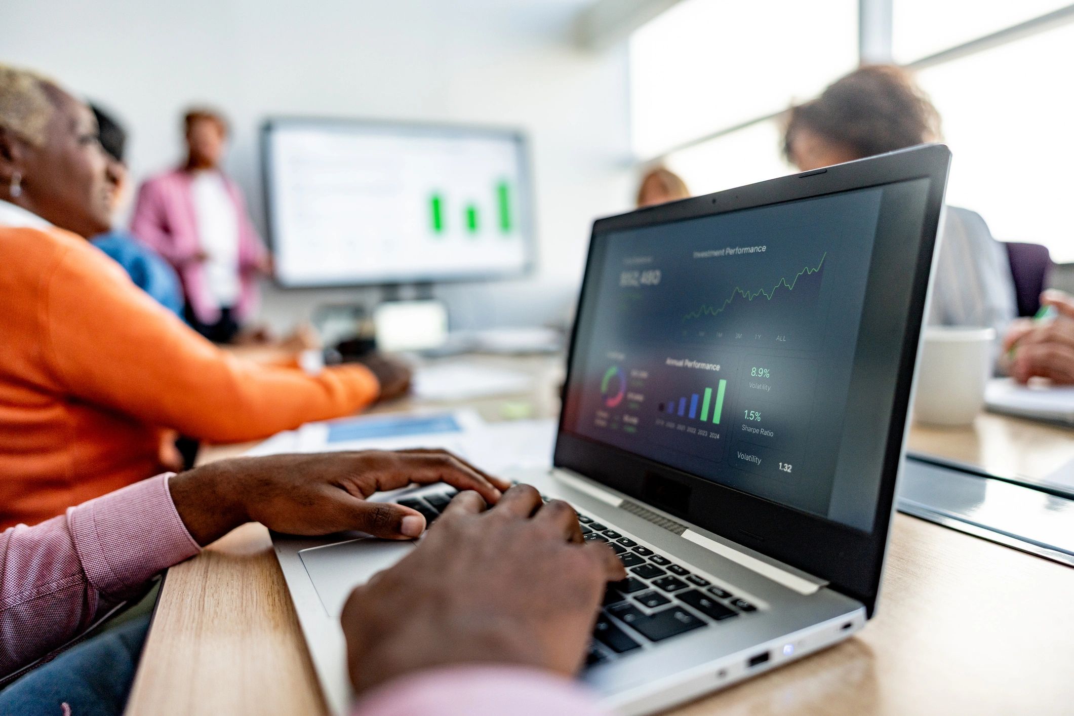 Business meeting in an office discussing property management documents